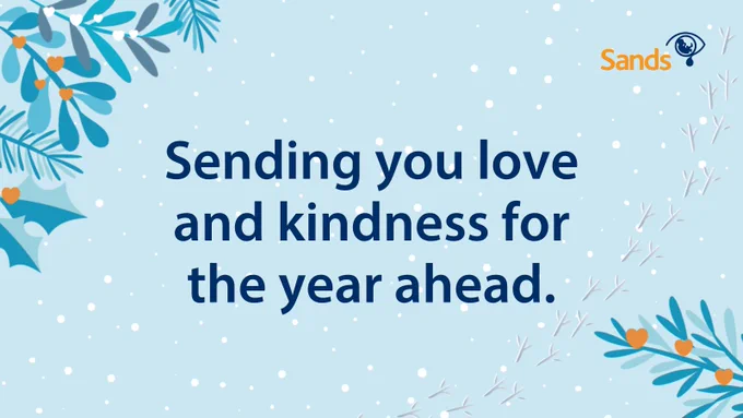 Snowy winter scene with text "Sending you love and kindness for the year ahead."