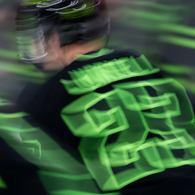 a motion blur photo of esa lindell's back showing off #23
