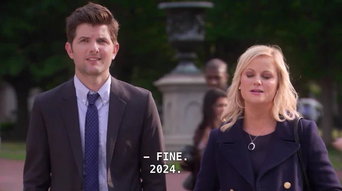 Leslie and Ben standing and saying "Fine. 2024."