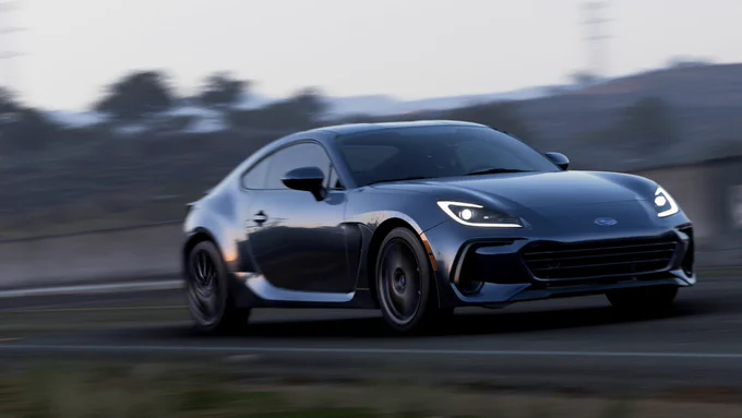 A 2022 Subaru BRZ finished in my interpretation of Magnetite Gray Metallic speeding along the Sierra Verde dam bridge in Forza Horizon 5.