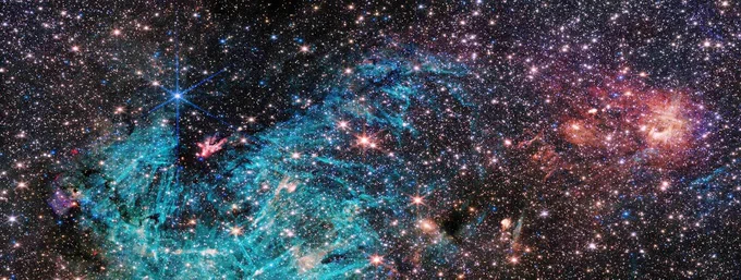 The NIRCam (Near-Infrared Camera) instrument on NASA’s James Webb Space Telescope’s reveals a portion of the Milky Way’s dense core in a new light. An estimated 500,000 stars shine in this image of the Sagittarius C (Sgr C) region, along with some as-yet unidentified features.  Credit: NASA, ESA, CSA, STScI, and S. Crowe (University of Virginia).
