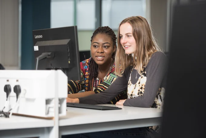 Student and staff working on a university PC