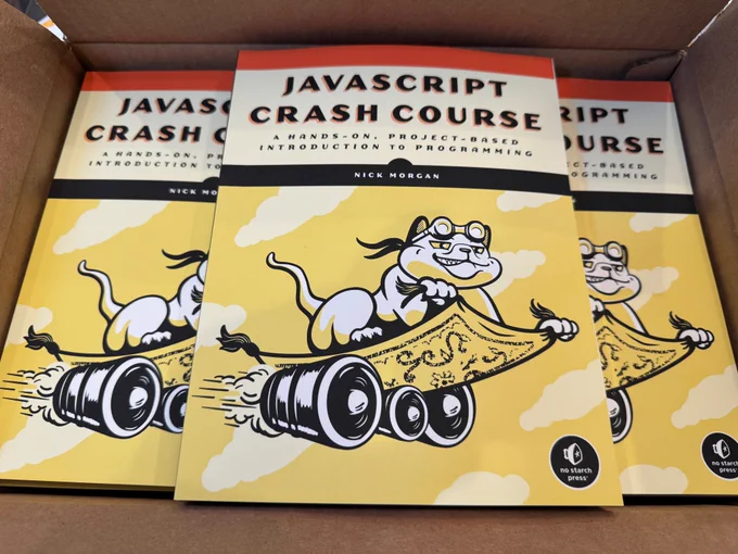 A box full of copies of JavaScript Crash Course