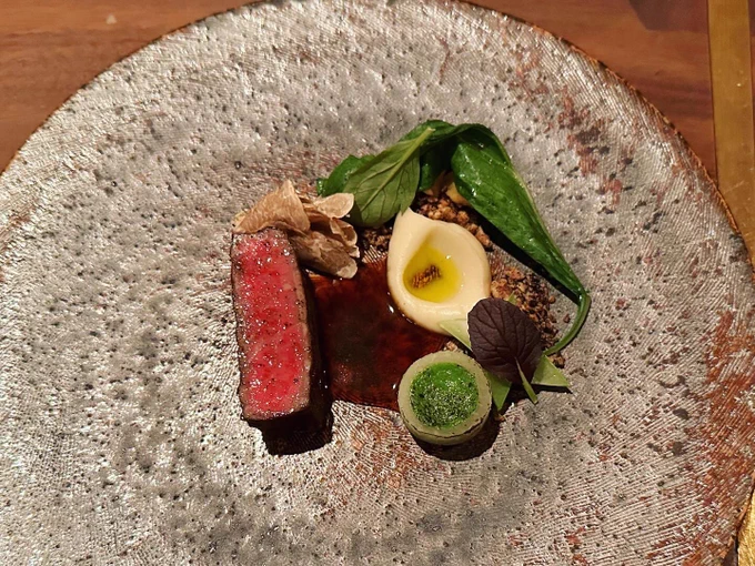 A slice of beef with vegetables