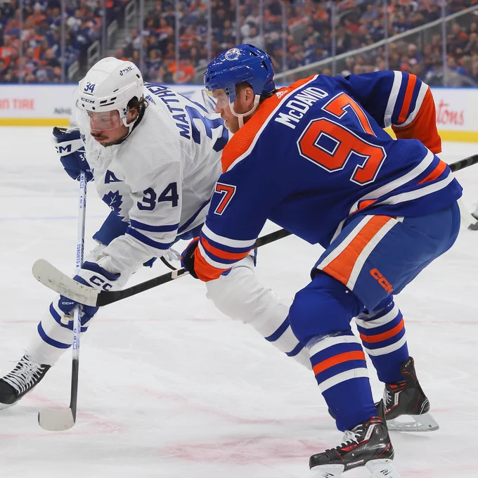 McDavid taking a draw against Matthews at Rogers Place. 