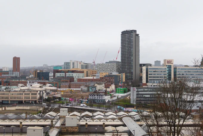 A panorama of Sheffield city centre taken from the hill behind the station, showing the station, The Showroom, Sheffield Hallam University and St Pauls Place tower