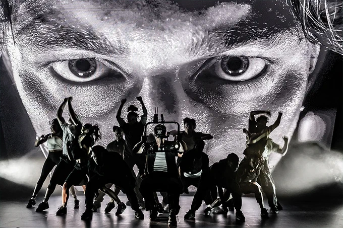 A photo showing a group of performers on stage