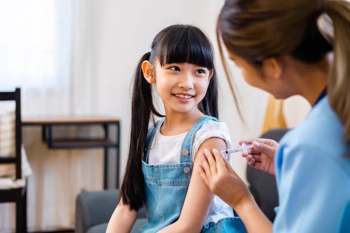 Child having a vaccine administered 