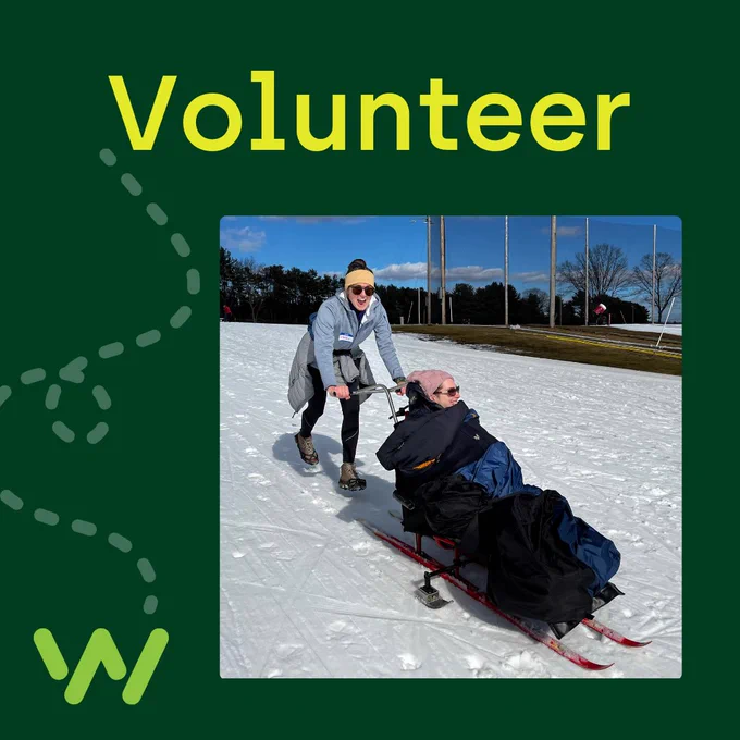 Graphic on dark green background of text “Volunteering” with a dotted trail line, green “W” brand mark, and a photo of a young woman pushing another young woman who’s using a sit ski down a snow-covered ski slope.