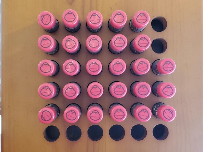 A grid of chapsticks. One way to count them is a 2x5 rectangle, and then a 3x6 rectangle underneath that.