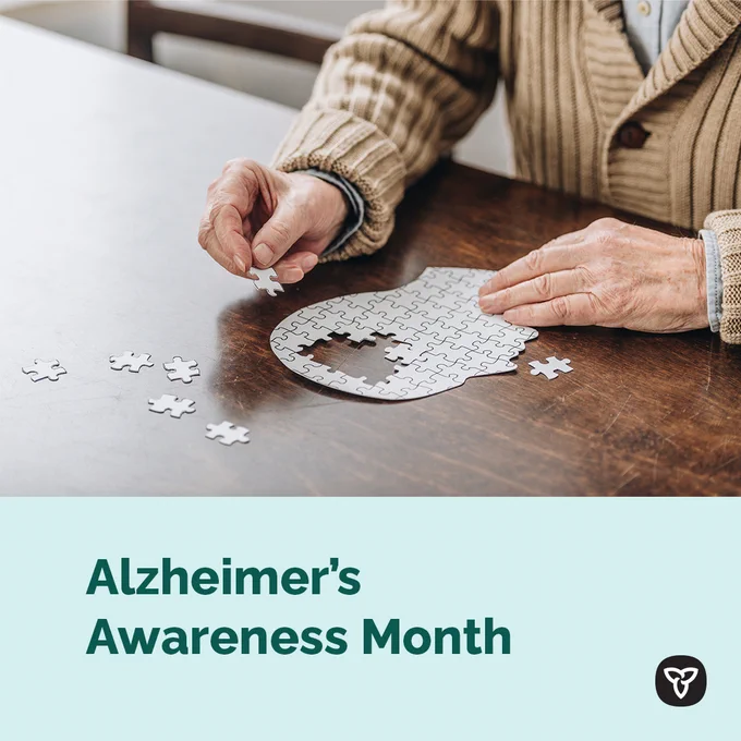 Image of senior doing a puzzle. Image text: Alzheimer’s Awareness Month.
