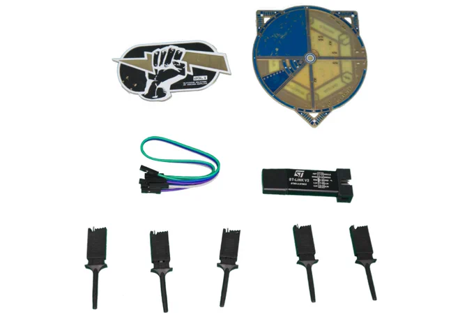 The kit containing a Bolt, an SWD debugger, cables, probes, and the target board