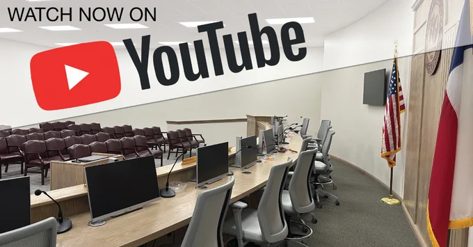 Image of council chambers with text above: Watch now on Youtube