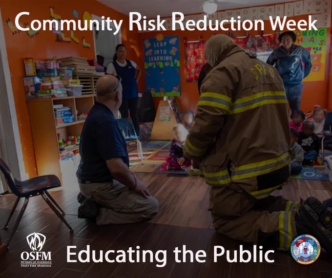 Firefighters teaching Fire Safety during Fire Prevention Week at a local preschool.