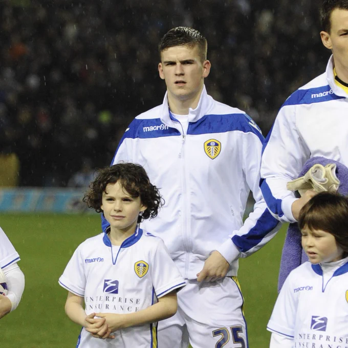 A six year old Archie Gray lines up as a mascot in front of Sam Byram ahead of a 2012 Capital One clash against Chelsea at Elland Road