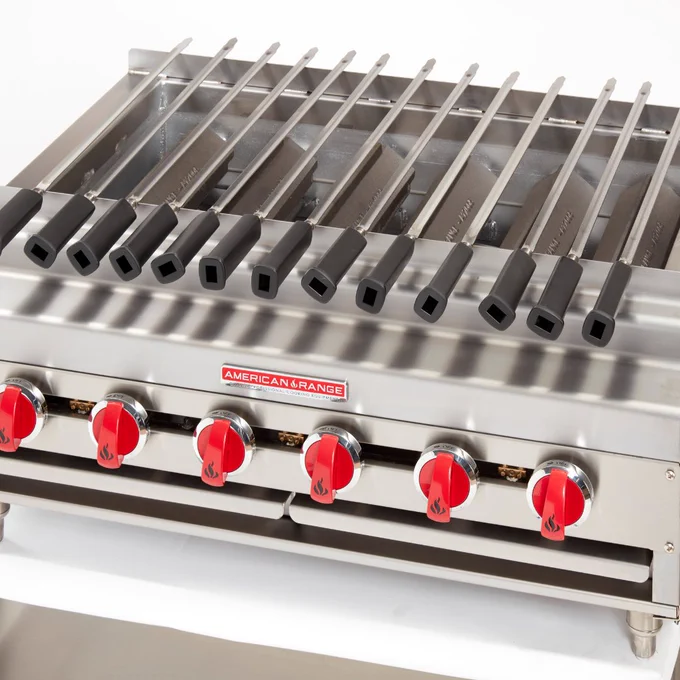 Image of an American Range Kebab Broiler with different skewers on a grate.