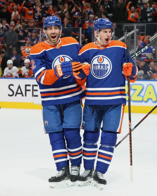 Future All Stars Evan Bouchard and Zach Hyman celebrating a goal. 