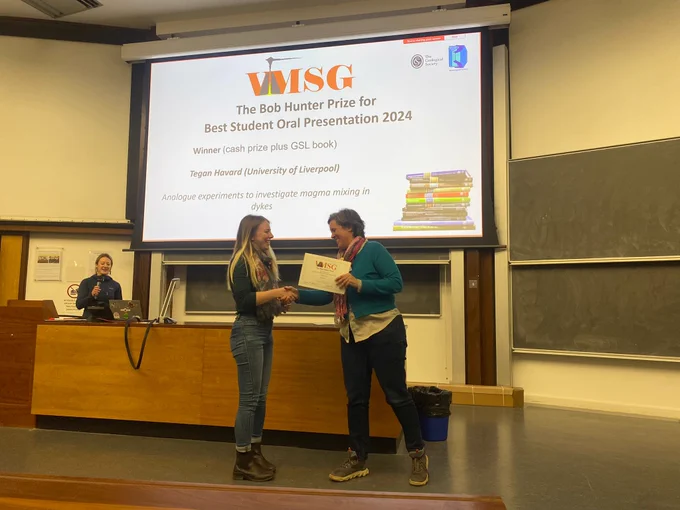 Photo of Tegan Havard receiving the certificate for her award