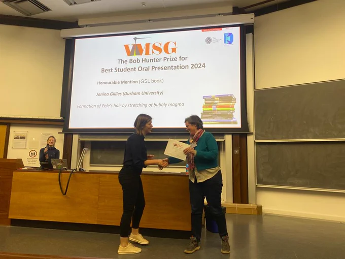 Photo of Janina Gillies receiving the certificate for her award