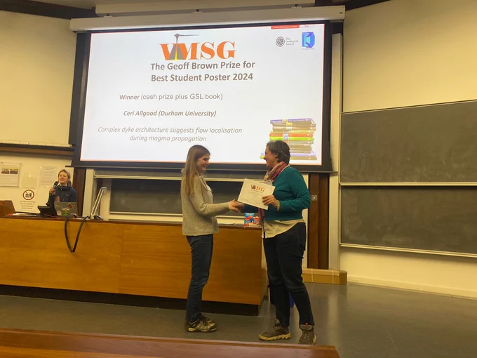 Photo of Ceri Allgood receiving the certificate for her award
