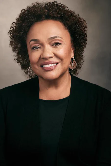 Maria Rosario Jackson, a middle aged Afro Latina woman with curly hair