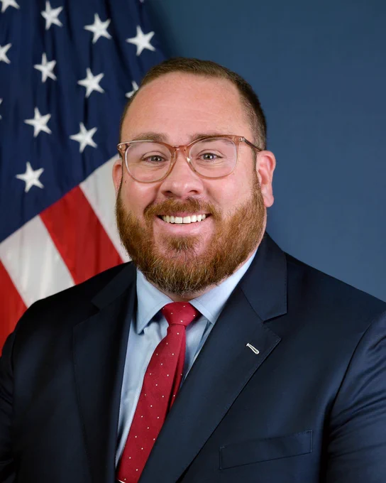 Official portrait of GLS Administrator Adam Tindall-Schlicht
