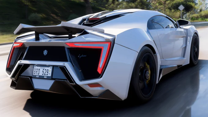 A 2016 W Motors Lykan Hypersport finished in my interpretation of Arctic White speeding along the roads west of Hotel Castillo in Forza Horizon 5.