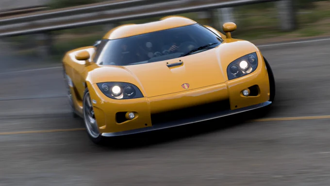 A 2006 Koenigsegg CCX finished in my interpretation of their Orange-Yellow drifting on the western quadrant of the Copper Canyon in Forza Horizon 5.