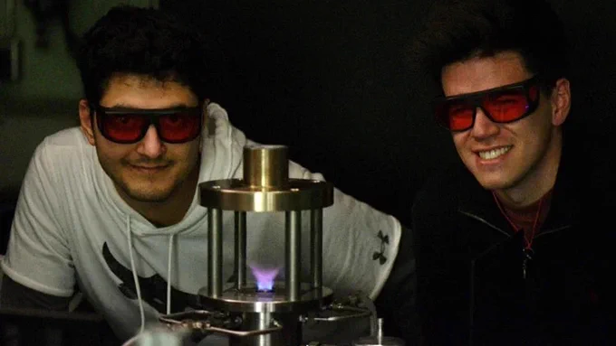 PhD candidate Yazdan Naderzadeh (left) and master’s student Scott Watson from the Propulsion and Energy Conversion Lab work with a swirling hydrogen flame