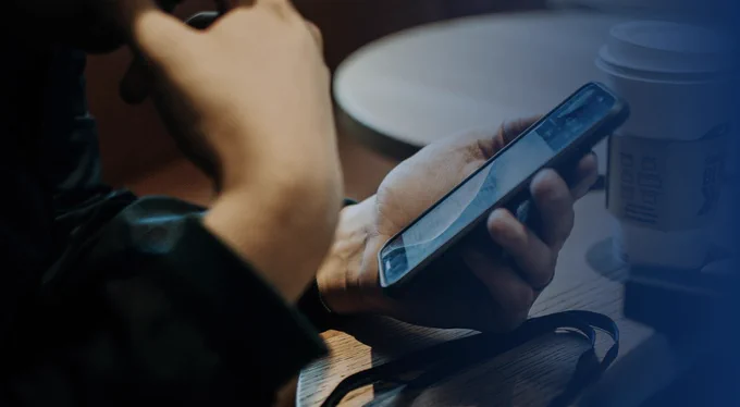 Person holding mobile phone