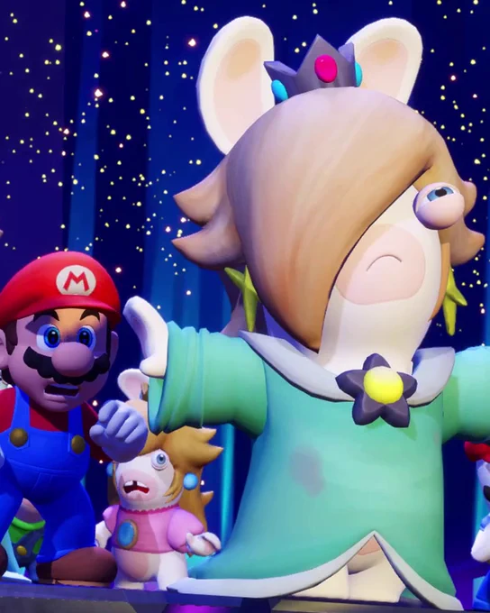 Rabbid Rosalina stands in front of Mario, Rabbid Peach and others with her arms spread out.