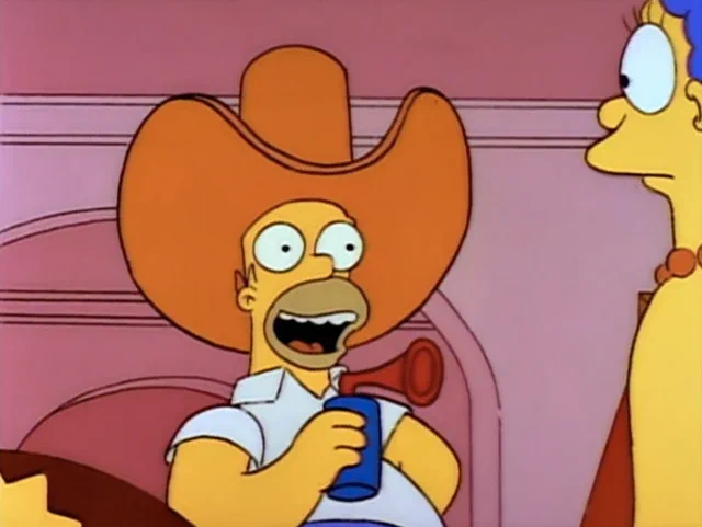 Homer Simpson, in his oversized novelty cowboy hat