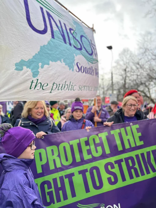 Christina McAnea with UNISON banners and ambulance workers