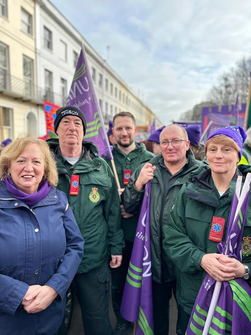 Christina McAnea with UNISON banners and ambulance workers