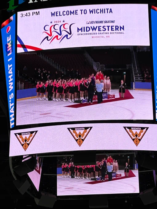 Screen with skaters lined up behind a podium 