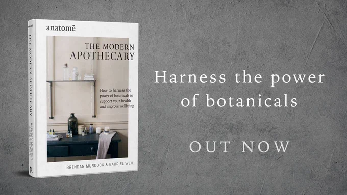 The cover of anatomē's 'The Modern Apothecary: How to harness the power of botanicals to support your health and improve wellbeing' on a textured grey background, featuring the captions 'Harness the power of botanicals' and 'OUT NOW'