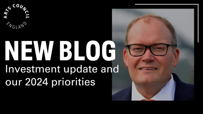'New Blog, Investment update and our 2024 priorities' white writing on black background. To the right is an image of Darren Henley - he's wearing glasses and a suit with an orange tie. 