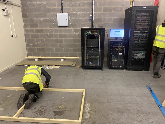 This job is to build stud work and flat roof to protect data servers with double louvered doors