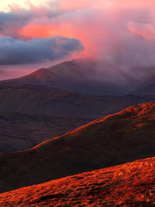 a red sunset a mountain in the Loch Lomond & Trossachs National Park 