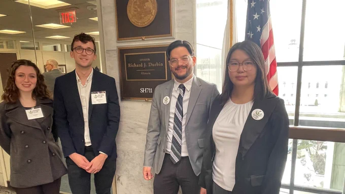 Four Federal Action Team volunteers pose for a photo outside of Senator Durbin's office.