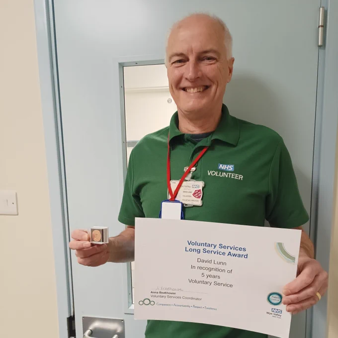 David with his 5 year volunteer certificate and badge 
