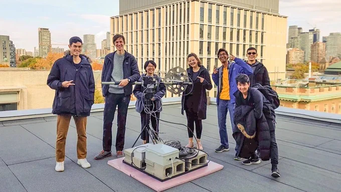 Members of the UTAT space systems division gather on the sixth-floor roof of the Bahen Centre for Information Technology with the fully assembled ground station