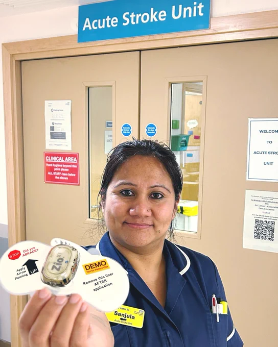 Sanjula Dhungana, Ward Manager of the Acute Stroke Unit at Worcestershire Royal Hospital holding one of the new Zio XT devices in its packaging before it is fitted.
