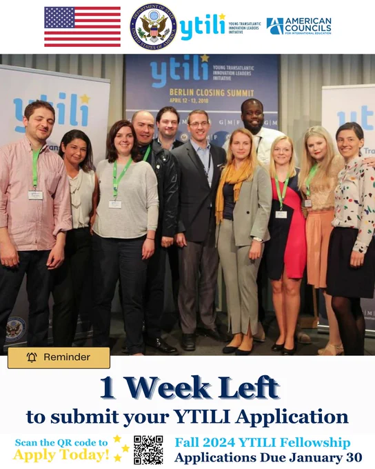 A group of YTILI fellows standing side by side smiling.