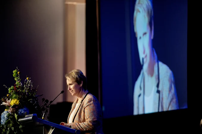 Natalie Kaddas, CEO of Kaddas Enterprises, gives remarks from a stage after receiving the Women’s Leadership Celebration Business Leadership award.