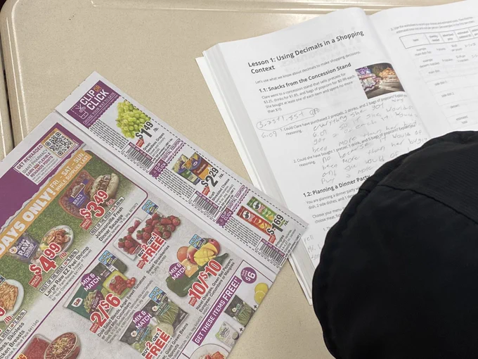 Grocery circular and student workbook.
