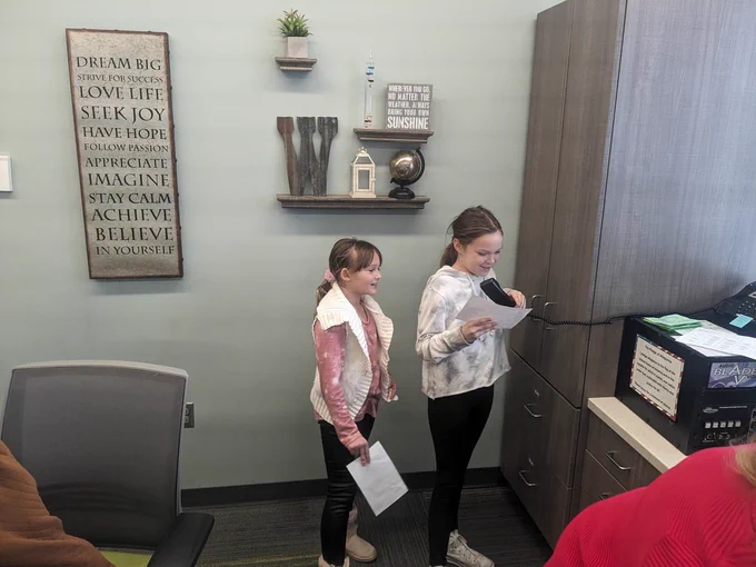 Weatherwomen from Mrs. Reer's class.