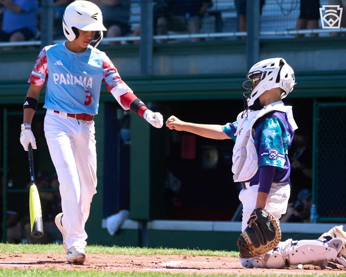 Catcher and batter fist bump at the LLWS