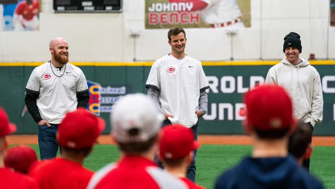 Blake Dunn, Carson Spiers and Jacob Hurtubise all smile at the Reds Youth Academy. 