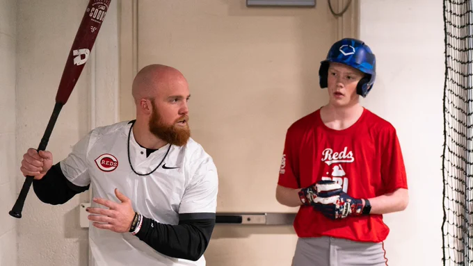 Blake Dunn goes through swing tips at the Reds Youth Academy. 